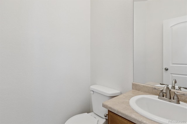 719 Elk Mountain Dr, Severance, CO 80550 - half bath featuring vanity and toilet