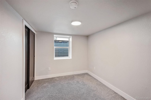 empty room featuring carpet flooring