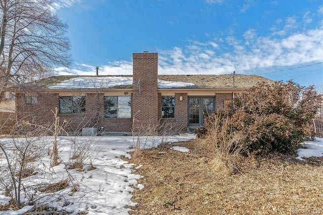 view of snow covered house