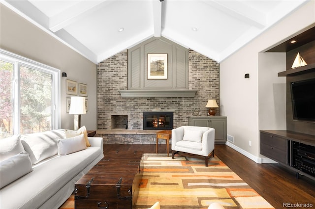living room with dark wood-style flooring, vaulted ceiling with beams, visible vents, baseboards, and a fireplace