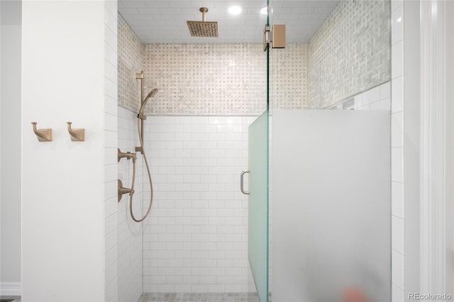 bathroom with a shower stall