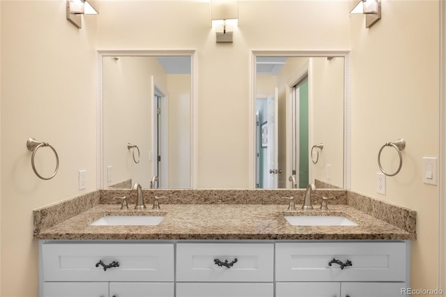 bathroom featuring double vanity and a sink