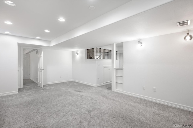 finished basement featuring recessed lighting, visible vents, carpet flooring, and baseboards