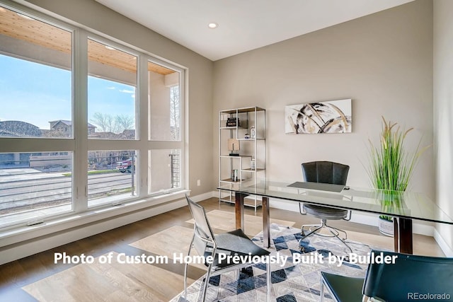 office space featuring recessed lighting, baseboards, and wood finished floors