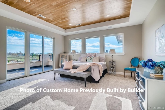 carpeted bedroom with visible vents, access to outside, a tray ceiling, and wood ceiling