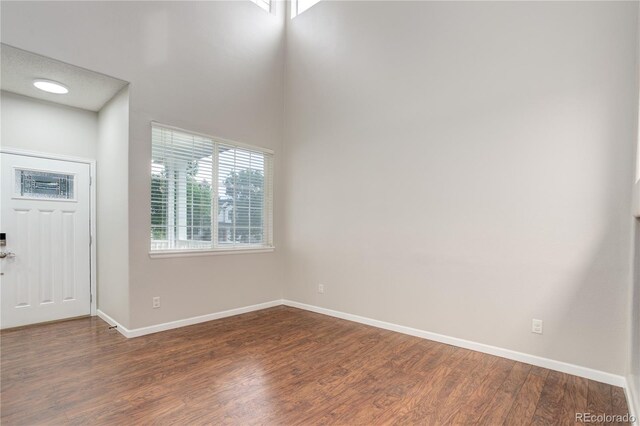15828 Greenstone Ln, Parker, CO 80134 - entryway featuring wood finished floors and baseboards