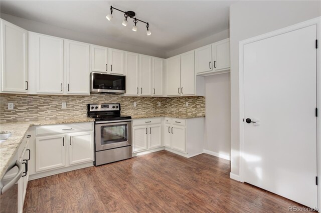 15828 Greenstone Ln, Parker, CO 80134 - kitchen with stainless steel appliances, decorative backsplash, wood finished floors, and white cabinetry