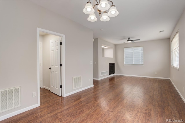 15828 Greenstone Ln, Parker, CO 80134 - unfurnished living room featuring a chandelier, wood finished floors, a ceiling fan, and baseboards