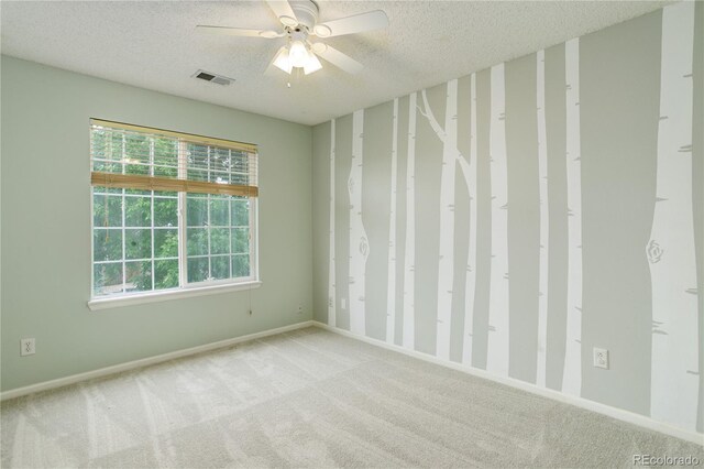 15828 Greenstone Ln, Parker, CO 80134 - spare room featuring a textured ceiling, carpet flooring, ceiling fan, and baseboards