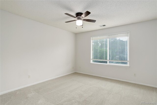 15828 Greenstone Ln, Parker, CO 80134 - spare room featuring carpet, a ceiling fan, a textured ceiling, and baseboards