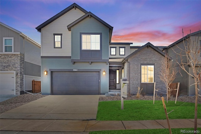 view of front of house featuring driveway, brick siding, a garage, and a front yard