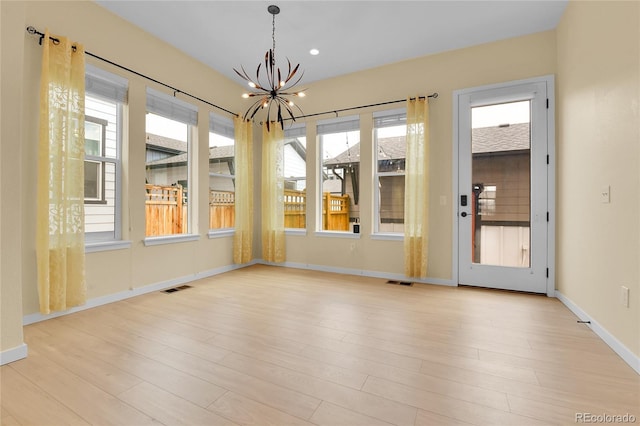 5154 Taft Ct, Wheat Ridge, CO 80033 - unfurnished sunroom with a chandelier and plenty of natural light