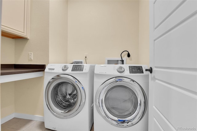 5154 Taft Ct, Wheat Ridge, CO 80033 - laundry area featuring independent washer and dryer, cabinet space, and light tile patterned floors
