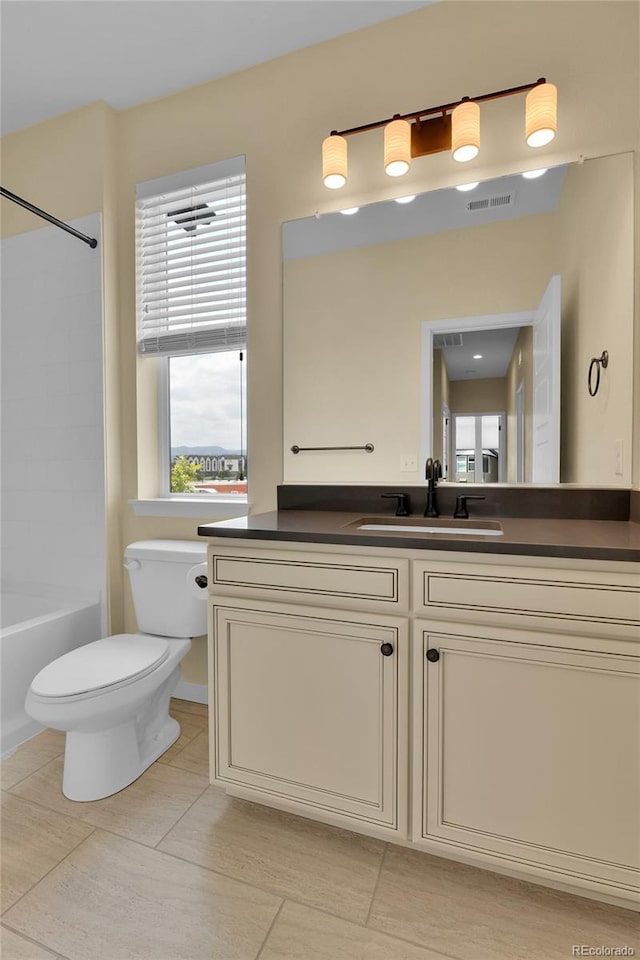 5154 Taft Ct, Wheat Ridge, CO 80033 - full bath featuring vanity, plenty of natural light, shower / tub combination, and tile patterned flooring