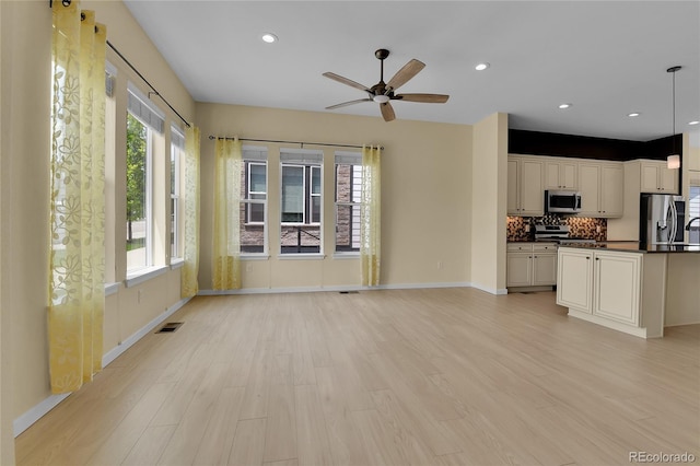5154 Taft Ct, Wheat Ridge, CO 80033 - unfurnished living room featuring light wood finished floors, a ceiling fan, and recessed lighting