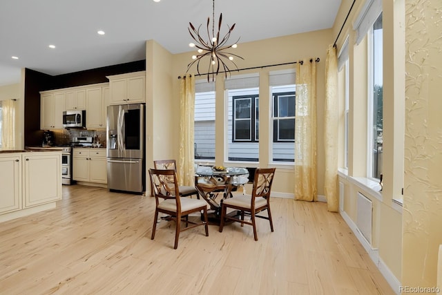 5154 Taft Ct, Wheat Ridge, CO 80033 - dining space with a chandelier, light wood finished floors, and recessed lighting