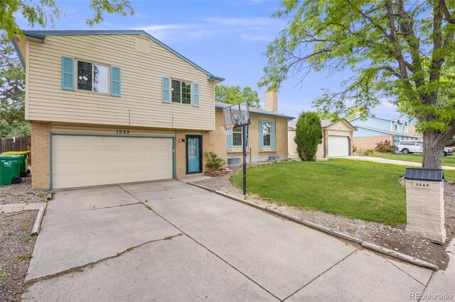 1549 S Evanston St, Aurora, CO 80012 - split level home featuring brick siding, an attached garage, and driveway
