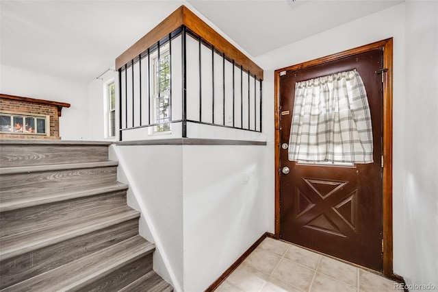 1549 S Evanston St, Aurora, CO 80012 - foyer entrance featuring stairs and baseboards