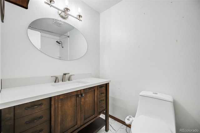 1549 S Evanston St, Aurora, CO 80012 - bathroom featuring vanity, toilet, and baseboards