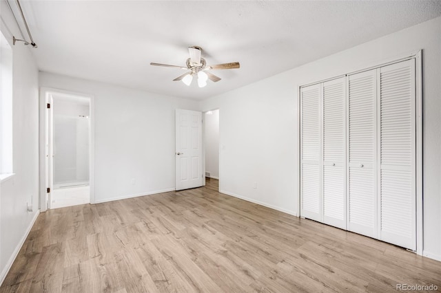 1549 S Evanston St, Aurora, CO 80012 - unfurnished bedroom with wood finished floors, baseboards, a closet, and ensuite bathroom