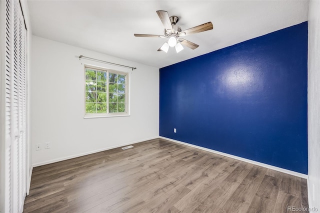 1549 S Evanston St, Aurora, CO 80012 - unfurnished bedroom featuring wood finished floors, baseboards, and ceiling fan