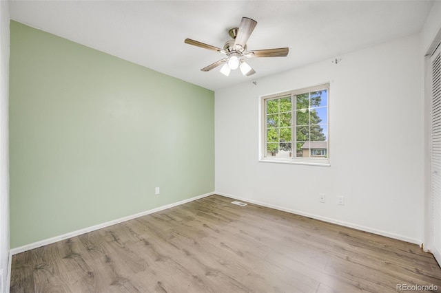 1549 S Evanston St, Aurora, CO 80012 - unfurnished bedroom featuring wood finished floors, a closet, baseboards, and a ceiling fan
