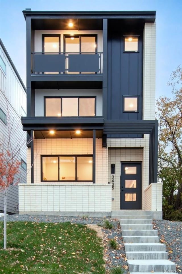 3435 W 17th Ave, Denver, CO 80204 - modern home featuring a balcony and board and batten siding
