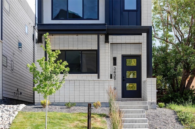 3435 W 17th Ave, Denver, CO 80204 - property entrance with board and batten siding