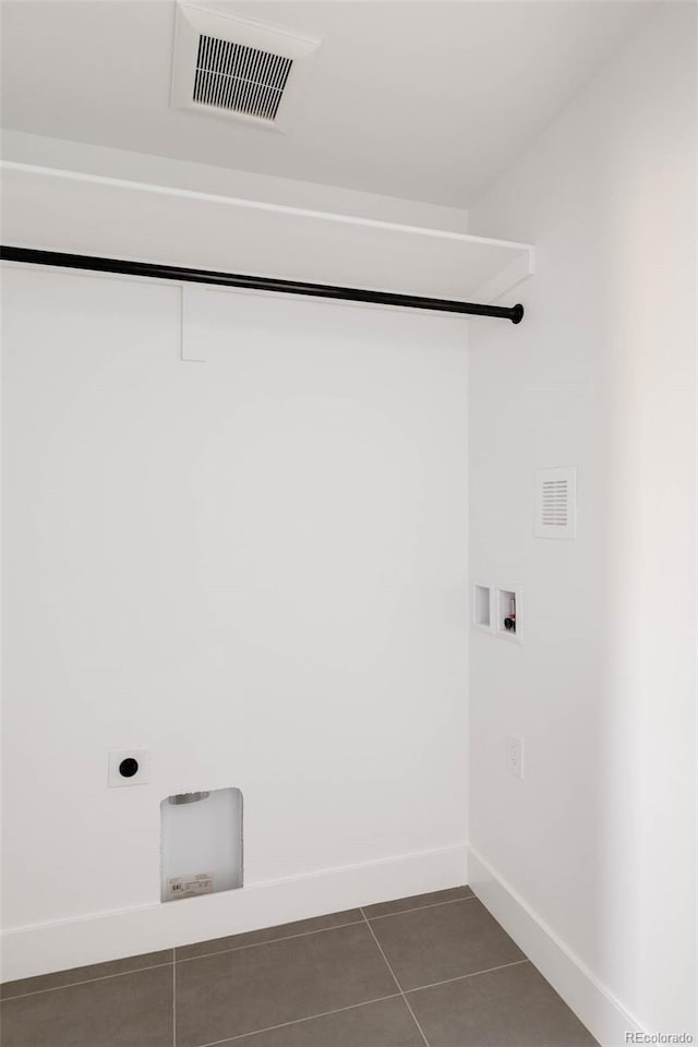 3435 W 17th Ave, Denver, CO 80204 - washroom with washer hookup, dark tile patterned flooring, and electric dryer hookup