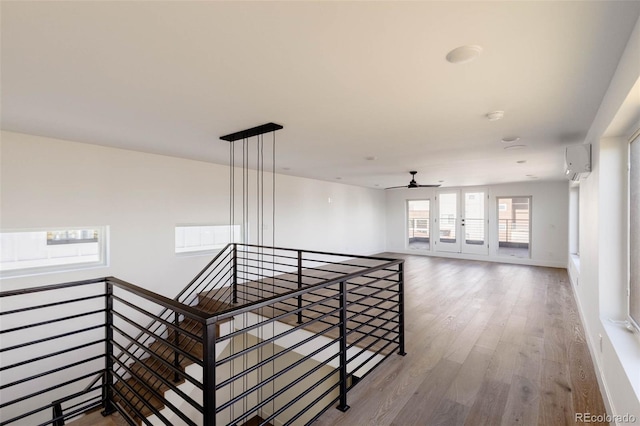 3435 W 17th Ave, Denver, CO 80204 - hallway featuring an upstairs landing, wood finished floors, and a wall unit AC
