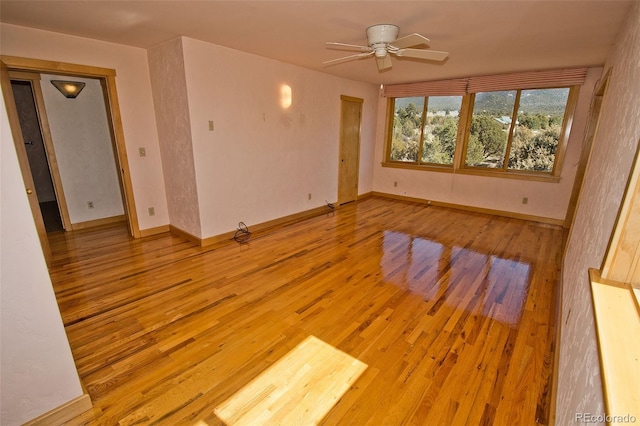 1507 Wagon Wheel Rd, Crestone, CO 81131 - unfurnished room with light wood-style flooring, a ceiling fan, and baseboards