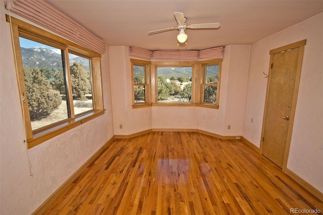1507 Wagon Wheel Rd, Crestone, CO 81131 - empty room with a ceiling fan, baseboards, and wood-type flooring