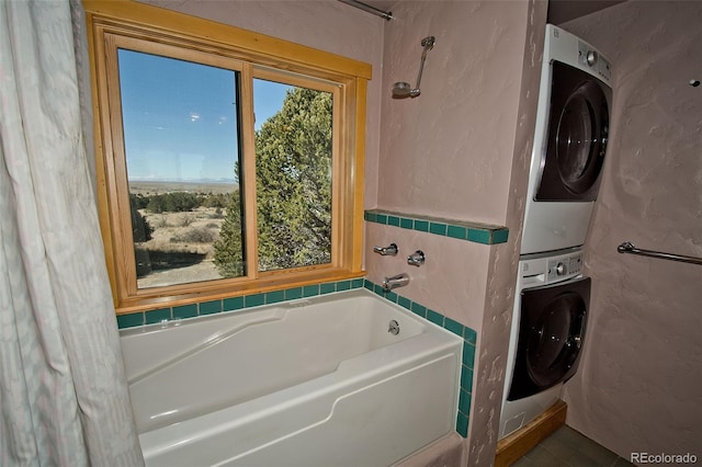 1507 Wagon Wheel Rd, Crestone, CO 81131 - washroom with a textured wall and stacked washer / dryer