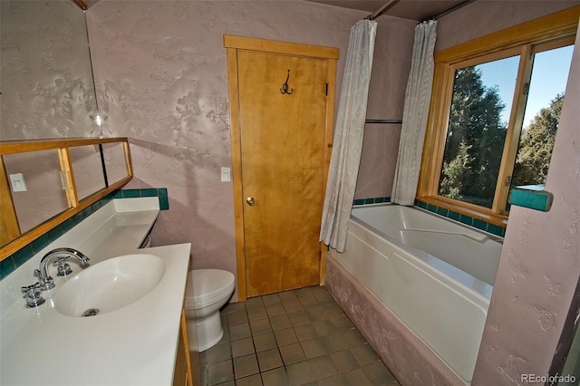 1507 Wagon Wheel Rd, Crestone, CO 81131 - bathroom with vanity, toilet, tile patterned flooring, and a textured wall