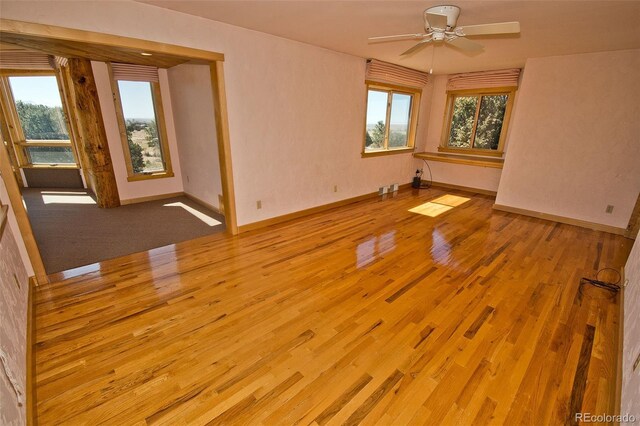 1507 Wagon Wheel Rd, Crestone, CO 81131 - unfurnished room featuring baseboards, wood finished floors, and a ceiling fan