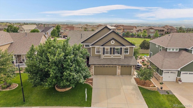11691 Riverdale Dr, Parker, CO 80138 - view of front facade featuring a residential view, concrete driveway, an attached garage, and a front yard