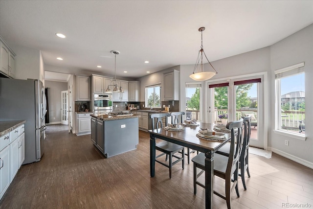 11691 Riverdale Dr, Parker, CO 80138 - dining room with dark wood-style flooring and recessed lighting