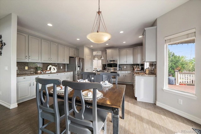 11691 Riverdale Dr, Parker, CO 80138 - dining space featuring dark wood-style floors and recessed lighting