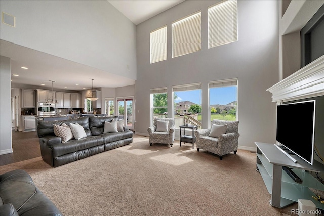 11691 Riverdale Dr, Parker, CO 80138 - living room featuring a high ceiling and recessed lighting