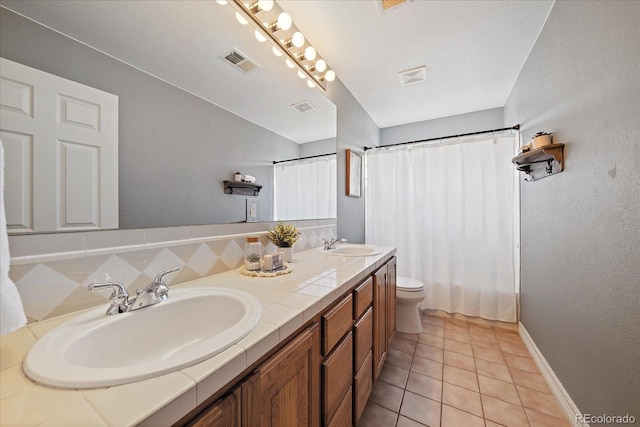 11691 Riverdale Dr, Parker, CO 80138 - full bath with double vanity and tile patterned flooring