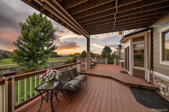 11691 Riverdale Dr, Parker, CO 80138 - deck at dusk featuring a fenced backyard and an outdoor hangout area