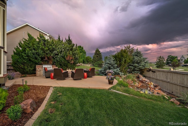 11691 Riverdale Dr, Parker, CO 80138 - yard at dusk with a patio area