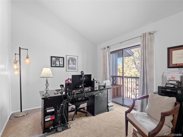 office area with lofted ceiling, light carpet, and baseboards