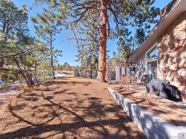 view of yard featuring fence