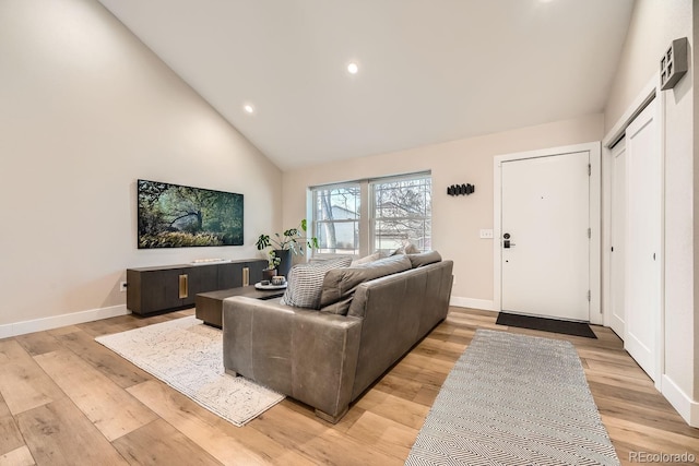 6443 S Florence Way, Englewood, CO 80111 - living area with light wood finished floors, recessed lighting, and high vaulted ceiling