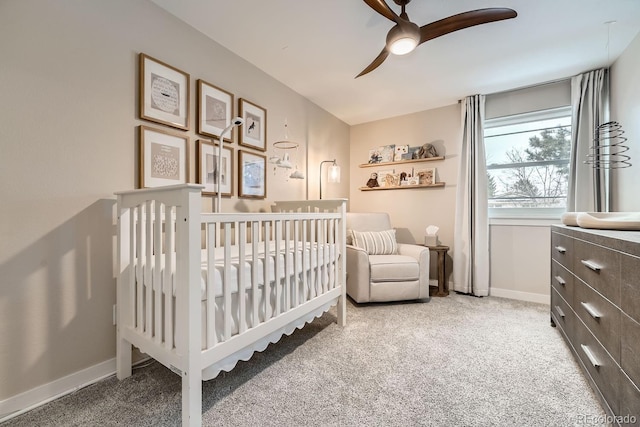6443 S Florence Way, Englewood, CO 80111 - bedroom with carpet, a crib, and a ceiling fan