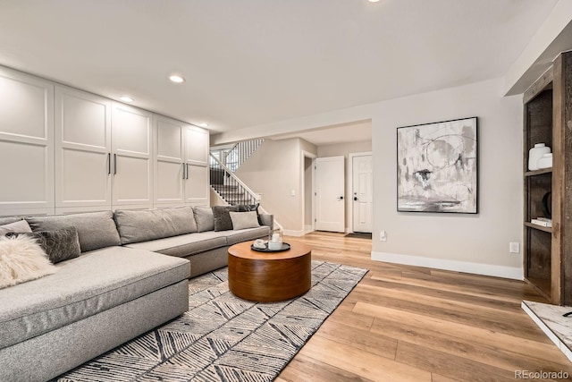 6443 S Florence Way, Englewood, CO 80111 - living area with light wood-style floors, stairway, and recessed lighting