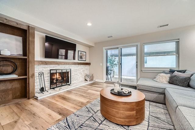 6443 S Florence Way, Englewood, CO 80111 - living room with a fireplace, wood finished floors, and recessed lighting