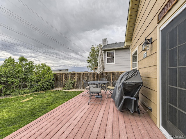 wooden terrace featuring outdoor dining area and area for grilling