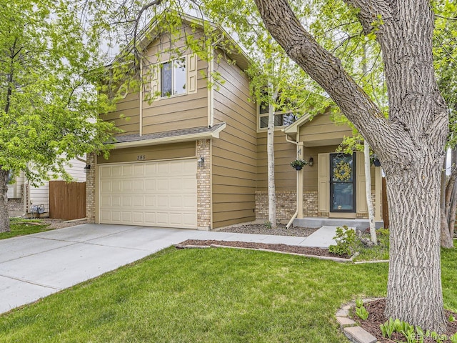 view of front of property featuring brick siding, driveway, and a garage
